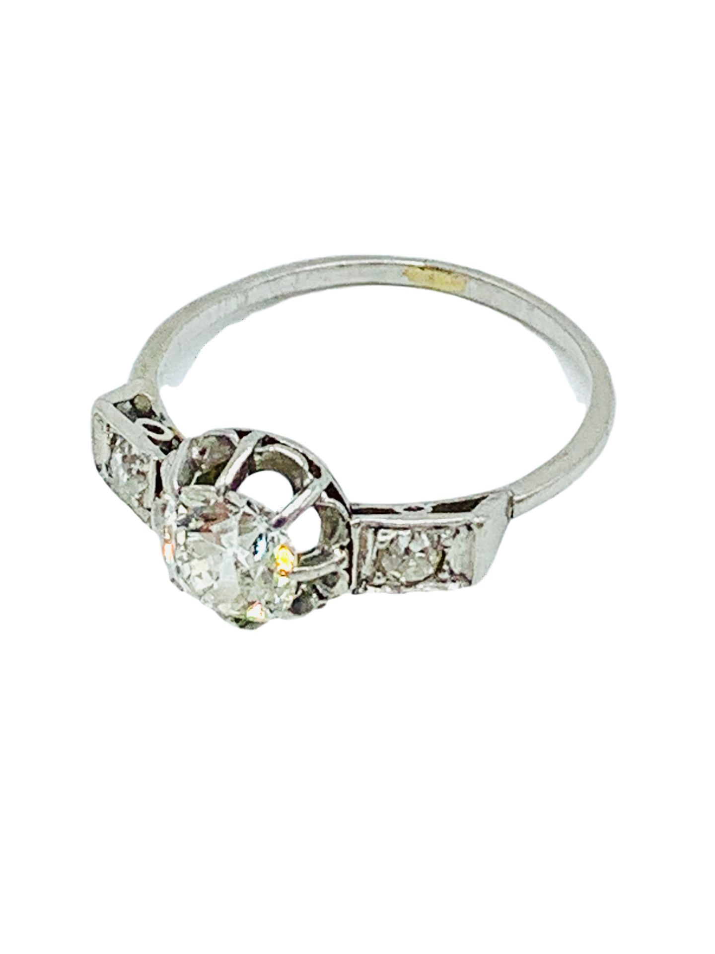 18ct white gold diamond ring with diamonds to shoulders.