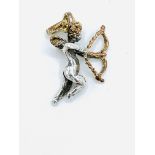 Victorian silver cupid pendant with gilded wings, bow and halo.