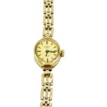 Rotary 9ct gold case lady's wrist watch with 9ct gold strap.