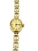 Rotary 9ct gold case lady's wrist watch with 9ct gold strap.