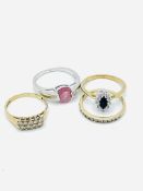 Collection of four 9ct gold rings set with various precious stones