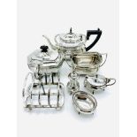 Silver teapot, sugar bowl, tea caddy, salt, mustard, and pepper pot.