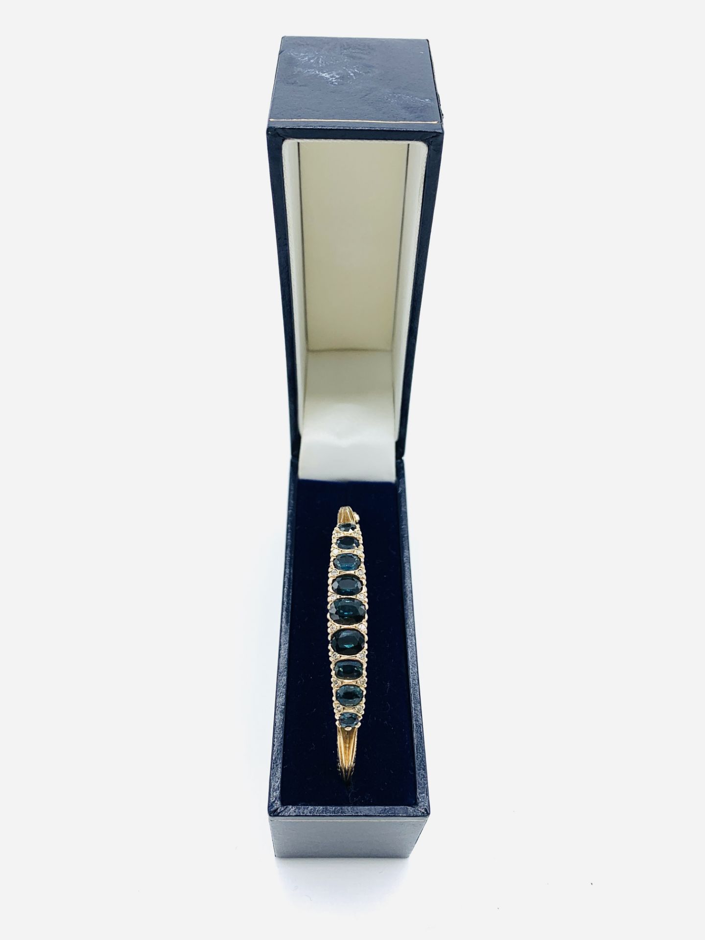 9ct gold bracelet set with 9 clawset graduated sapphires and small diamonds. - Image 3 of 4
