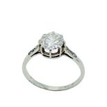 18ct white gold diamond solitaire ring with diamonds to shoulder.