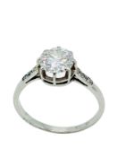 18ct white gold diamond solitaire ring with diamonds to shoulder.