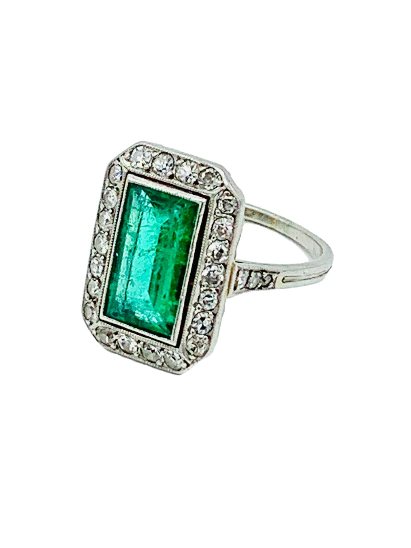 18ct white gold diamond and emerald ring.