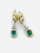 Diamond and emerald pendant earrings set in 9ct gold.