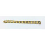 750 white and yellow gold link bracelet.
