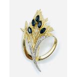 9ct gold diamond and sapphire brooch.