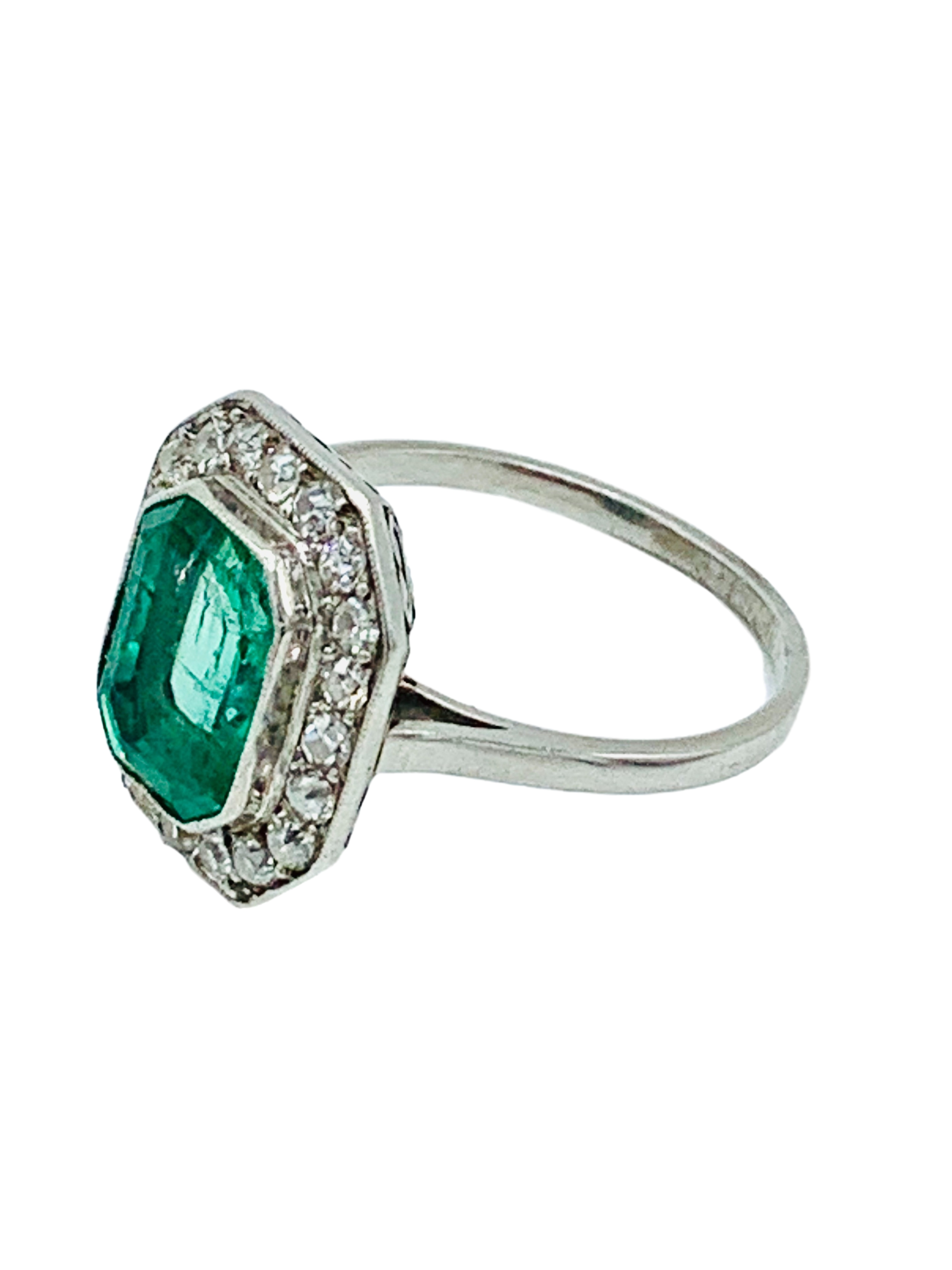 18ct white gold octagonal set Columbian emerald and diamond ring.