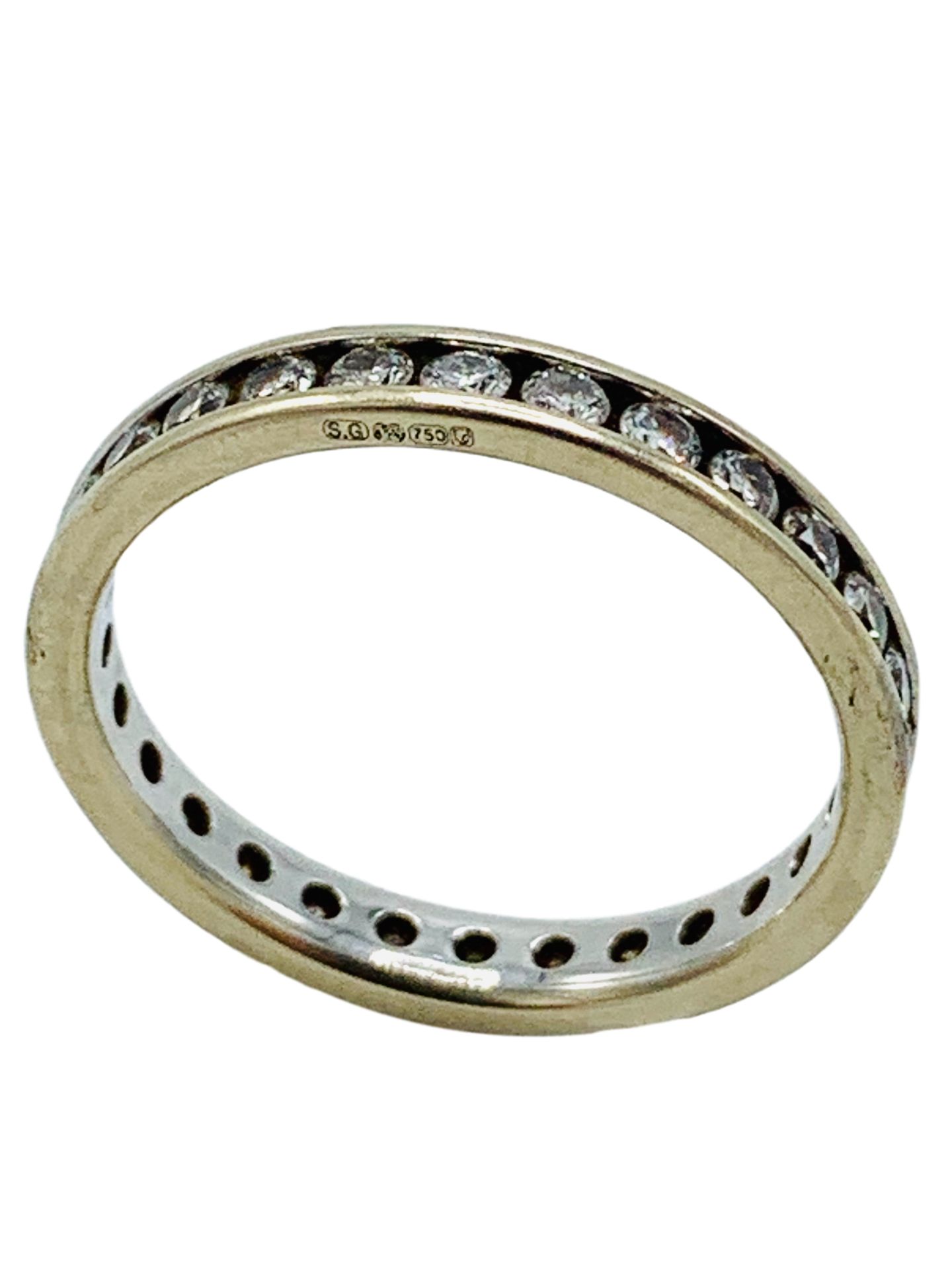 18ct white gold channel set diamond eternity ring.