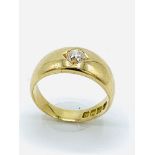18ct yellow gold flush set diamond solitaire ring.