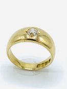 18ct yellow gold flush set diamond solitaire ring.