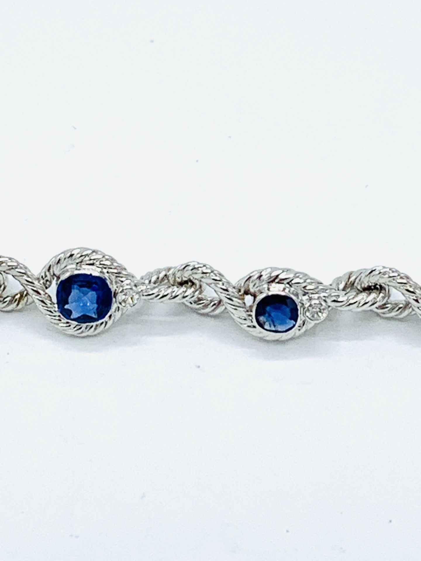 18ct white gold and graduated sapphire twisted bracelet. - Image 8 of 8