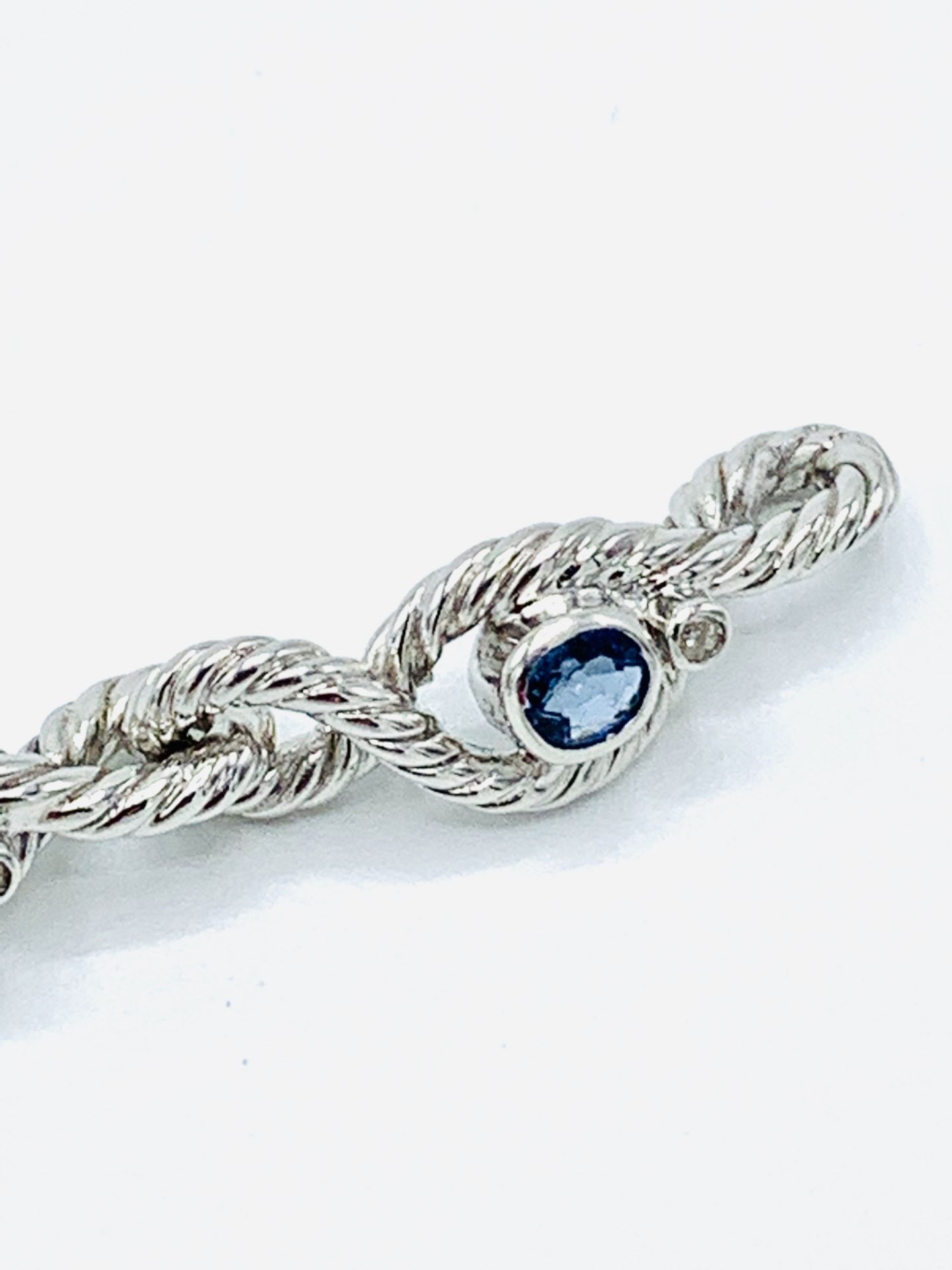 18ct white gold and graduated sapphire twisted bracelet. - Image 4 of 8