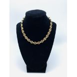 9ct gold necklace of oval shaped links, one missing and repaired, length 37cms, weight 26gms.