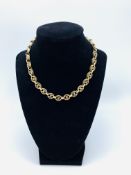 9ct gold necklace of oval shaped links, one missing and repaired, length 37cms, weight 26gms.