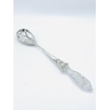 Hallmarked silver serving spoon with cut glass handle, London 1900.