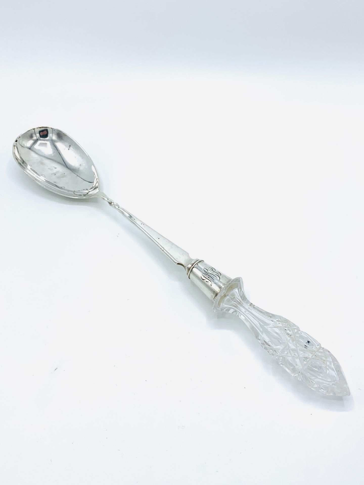 Hallmarked silver serving spoon with cut glass handle, London 1900.