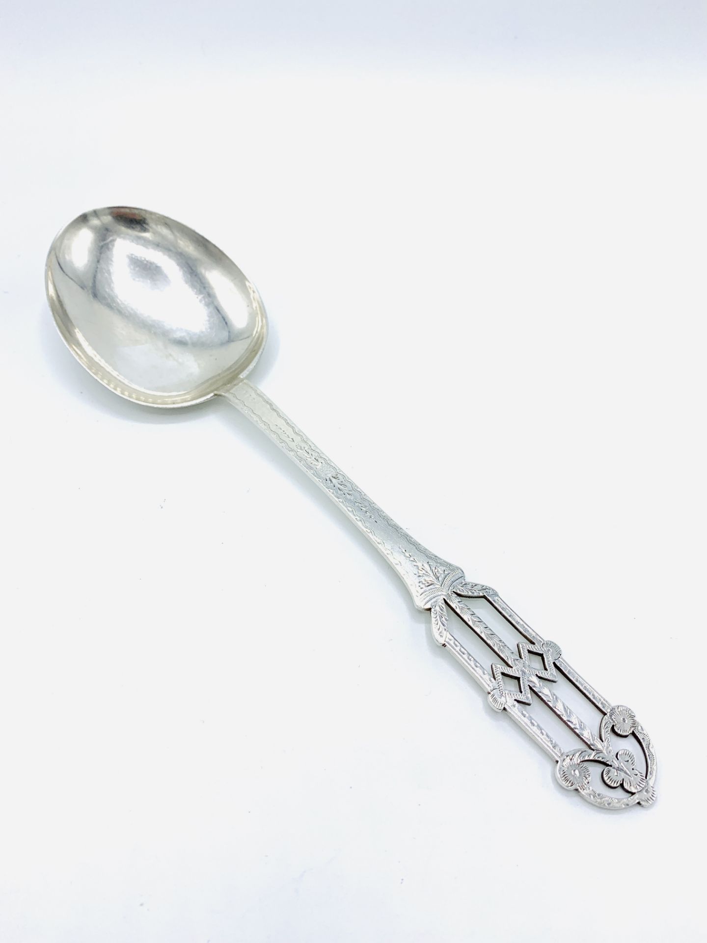 Hand pierced and engraved arts and crafts serving spoon.