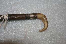 Side saddle whip with horn hook handpart, approx. length 37ins.