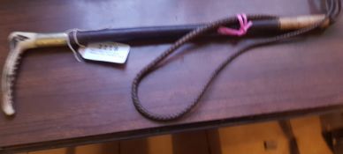 Hunt whip with bone handle and leather thong