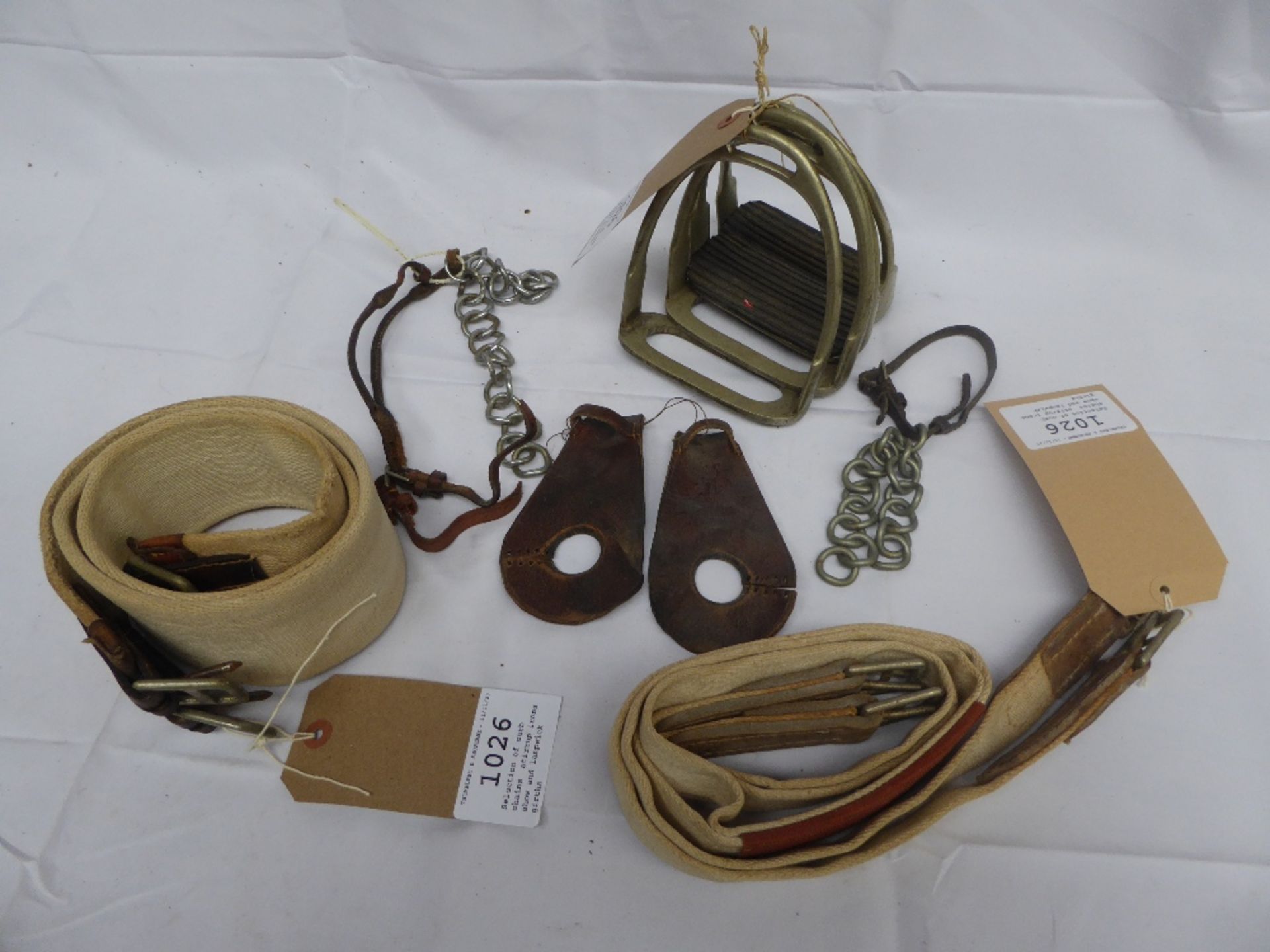 Selection of curb chains, stirrup irons, show and Lampwick girths