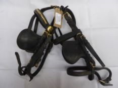 2 vintage brown leather driving pony bridles - 1 with decorative brass brow band and rosettes; in go