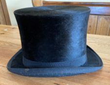 Small black top hat by Christy's of London to suit a youth or small adult, internal circumference me