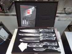 Five piece knife set in wooden box.