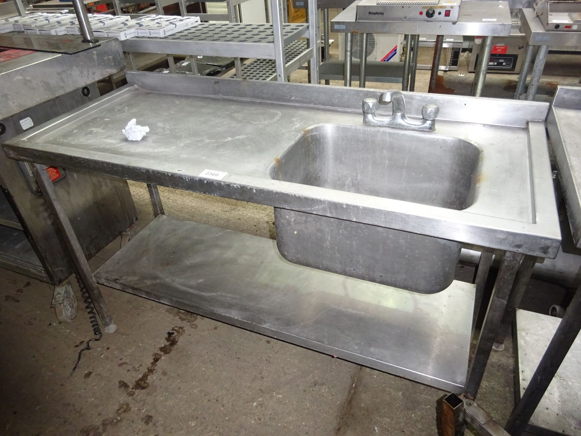 Single bowl left hand drainer with undershelf and taps.