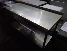 Stainless steel prep table with drawer, shelf and tin opener.