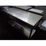 Stainless steel prep table with drawer, shelf and tin opener.