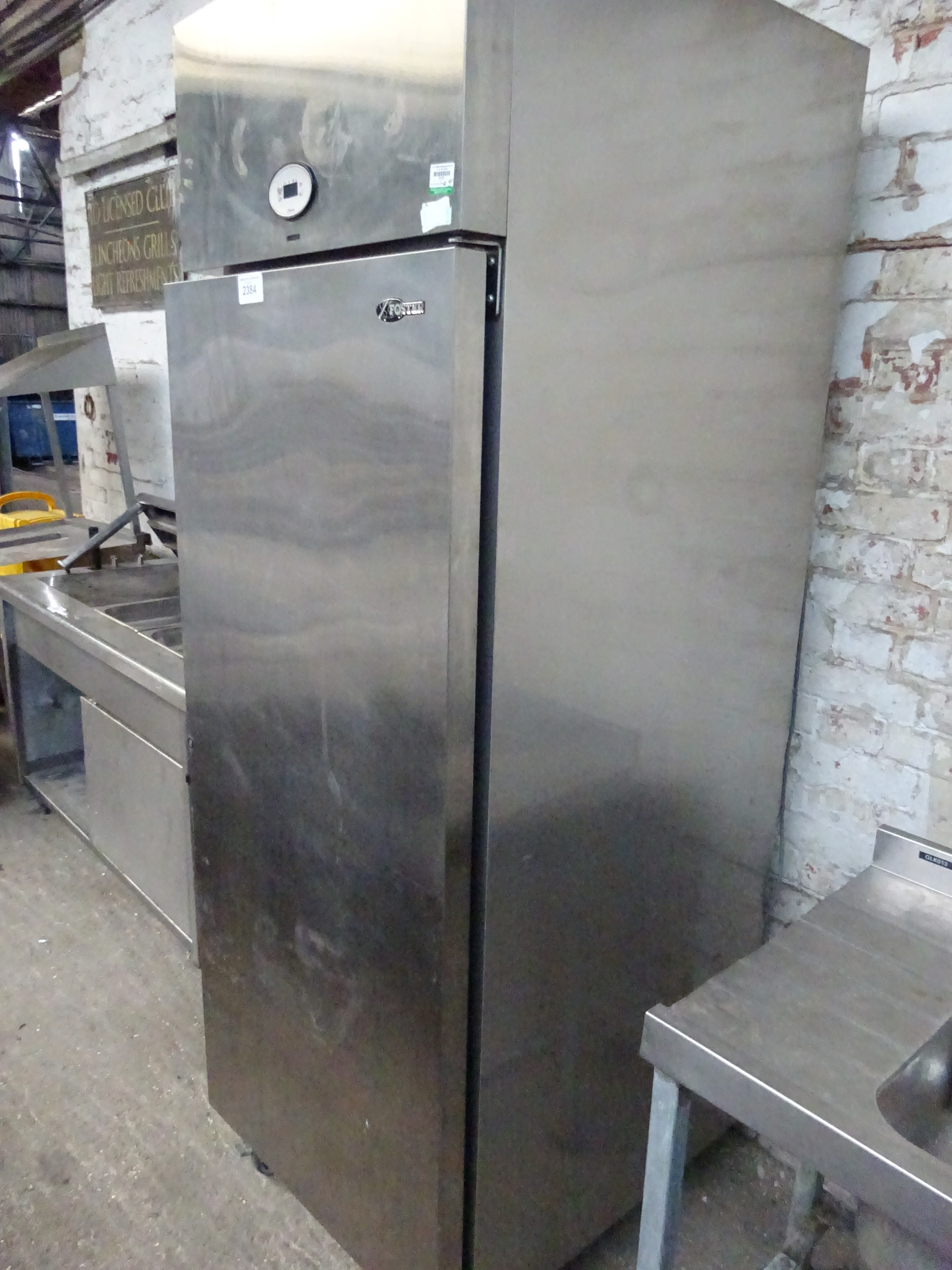 Fosters stainless steel single door upright fridge.