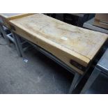 Wooden butchers block on stand, 122 x 62cms.