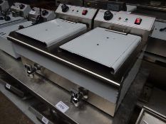 Infernus twin tank fryer with drain to front.