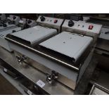 Infernus twin tank fryer with drain to front.