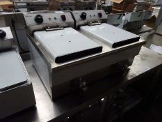 Infernus twin tank fryer with drain to front.
