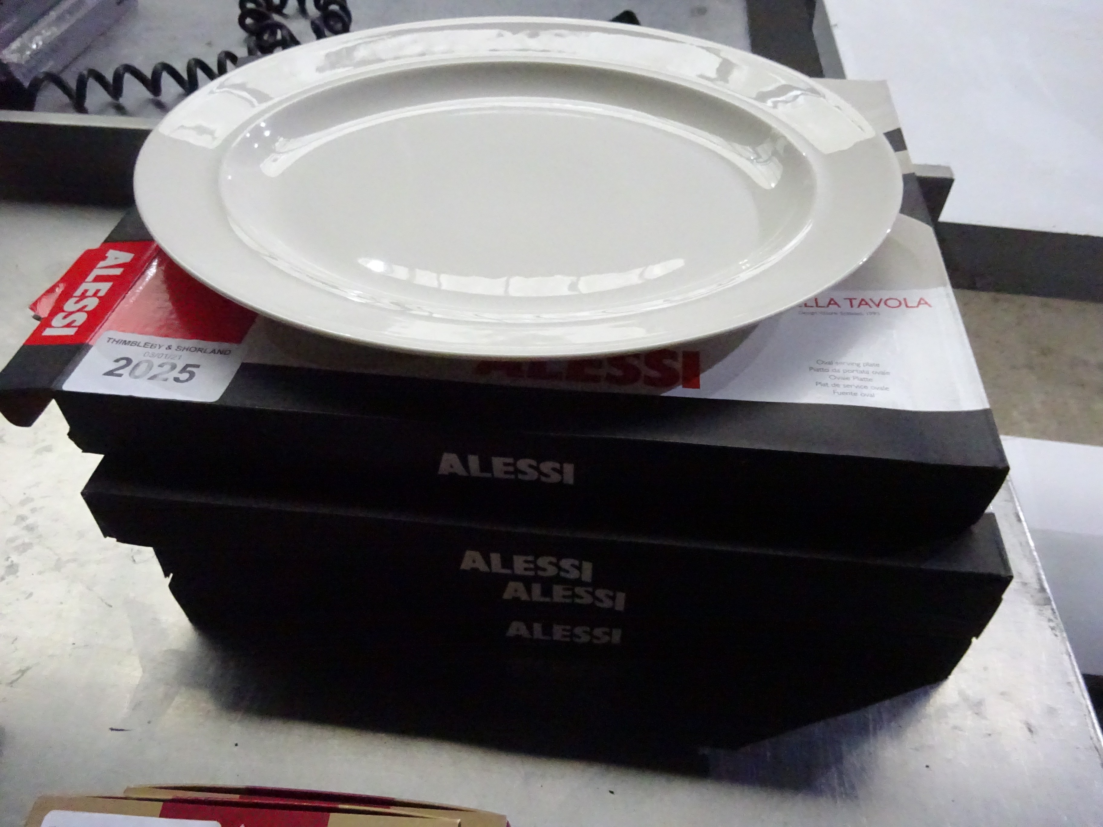 4 Alessi serving plates.