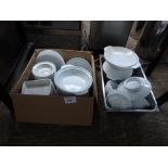 Two boxes of white china.