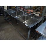 Double bowl with single drainer sink and taps.