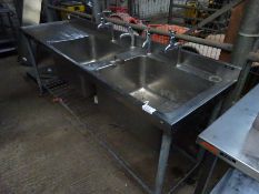 Double bowl with single drainer sink and taps.