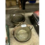 Four brass preserving pans.