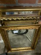 Three gilt framed wall mirrors.