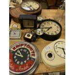 Eight various clocks and a Kodak Brownie Holiday Flash camera.