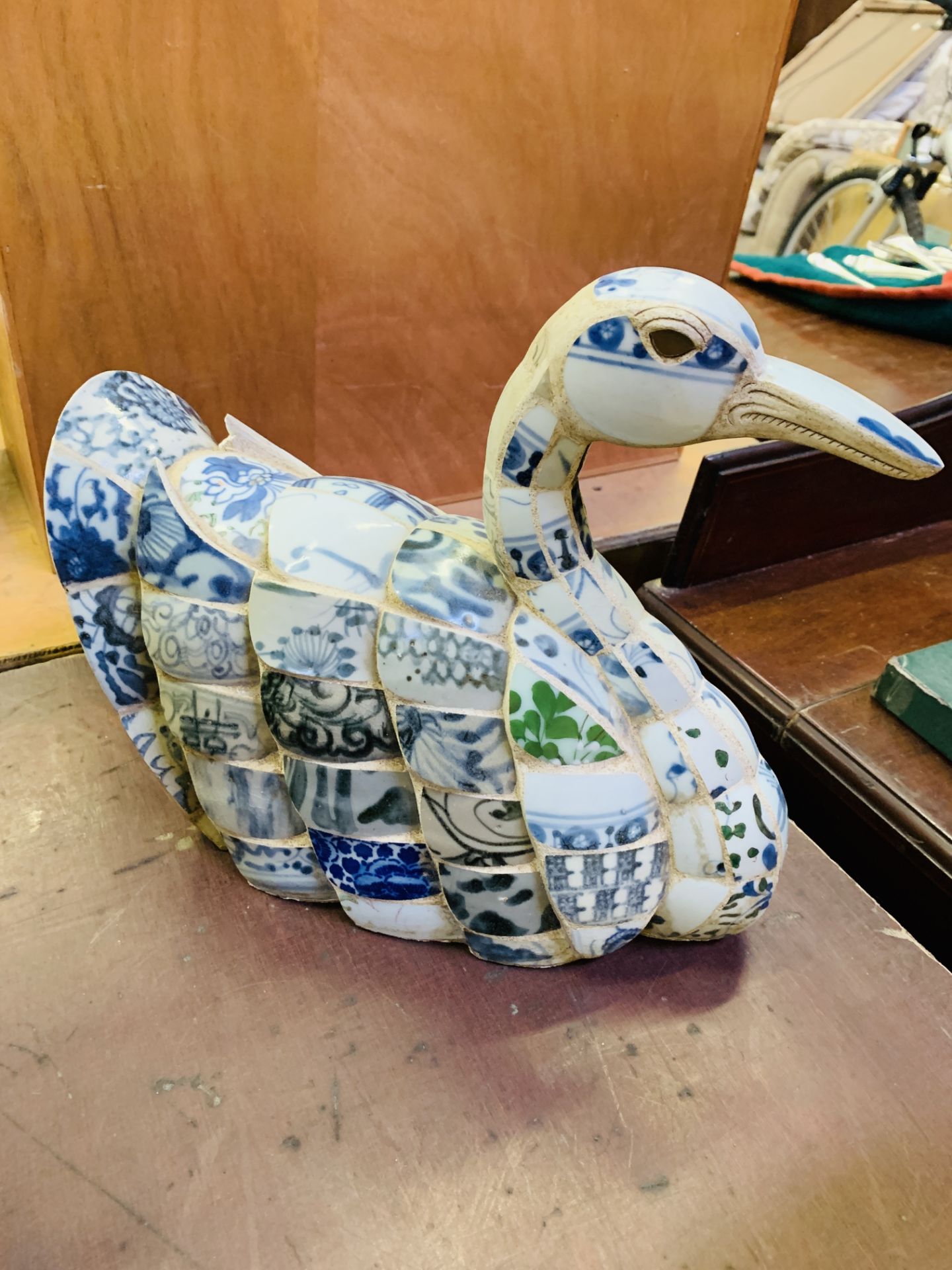 Ceramic mosaic swan figure.