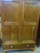 Edwardian double wardrobe with two drawers to base, on bracket feet.