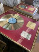 Nine presentation gold and silver record discs.