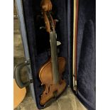 Violin (fitness) case and bow.