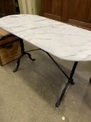 White marble top table on metal frame.